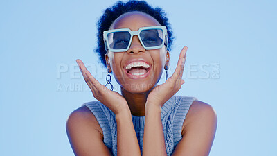 Buy stock photo Black woman, sunglasses and face in studio with happy, excited and fashion creativity by blue background. Gen z girl, glasses or shades for vision, portrait and happiness for accessory by backdrop