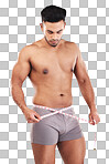 Weightloss, fitness and man with measure tape standing in a studio with a gray background. Health, strong and athlete with a healthy, exercise and diet lifestyle measuring his weight after a workout.