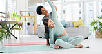 Laptop, yoga fitness and women or friends stretching on floor exercise together virtual training. Home pilates,  young people on ground for holistic body wellness women and stretching in home living room for health, wellness and fitness.