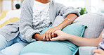 Holding hands, support and woman in a home living room with hope, trust and solidarity. House, people and love with forgiveness and grief of friends with empathy, kindness and gratitude together