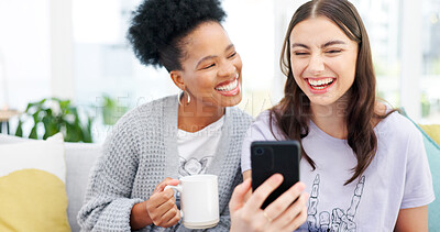 Buy stock photo Coffee, phone and girl friends on a sofa talking, bonding and networking on social media or mobile app. Happy, conversation and young women scroll on cellphone with latte in living room of apartment.