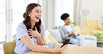 Woman, phone and laughing on video call for funny joke, meme or communication at home. Female talking on mobile smartphone with laugh for silly or fun conversation and discussion by living room table