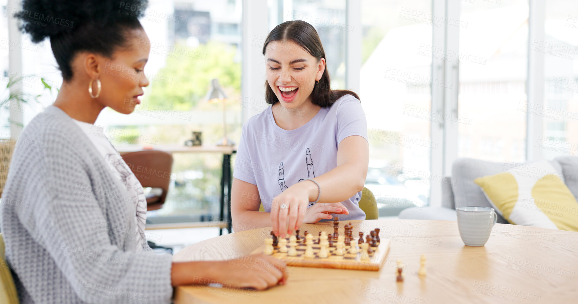 Buy stock photo Girl friends playing chess in the living room for bonding, entertainment or having fun together. Happy, smile and young interracial women enjoying board game in the lounge of modern apartment.