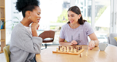 Buy stock photo Chess, board game and friends thinking about king, checkmate or strategy in home with women. People, challenge and play together on chessboard, table or happy competition in house living room