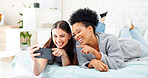 Friends relax with smartphone, scroll website and women talking, lying on bed with communication on mobile app. Technology, ecommerce and search online with people together, phone and online shopping