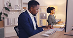 Business, writing and black man with notebook by computer working late for planning, proposal and project. Corporate, focus and male worker at desk schedule, website research and online report notes