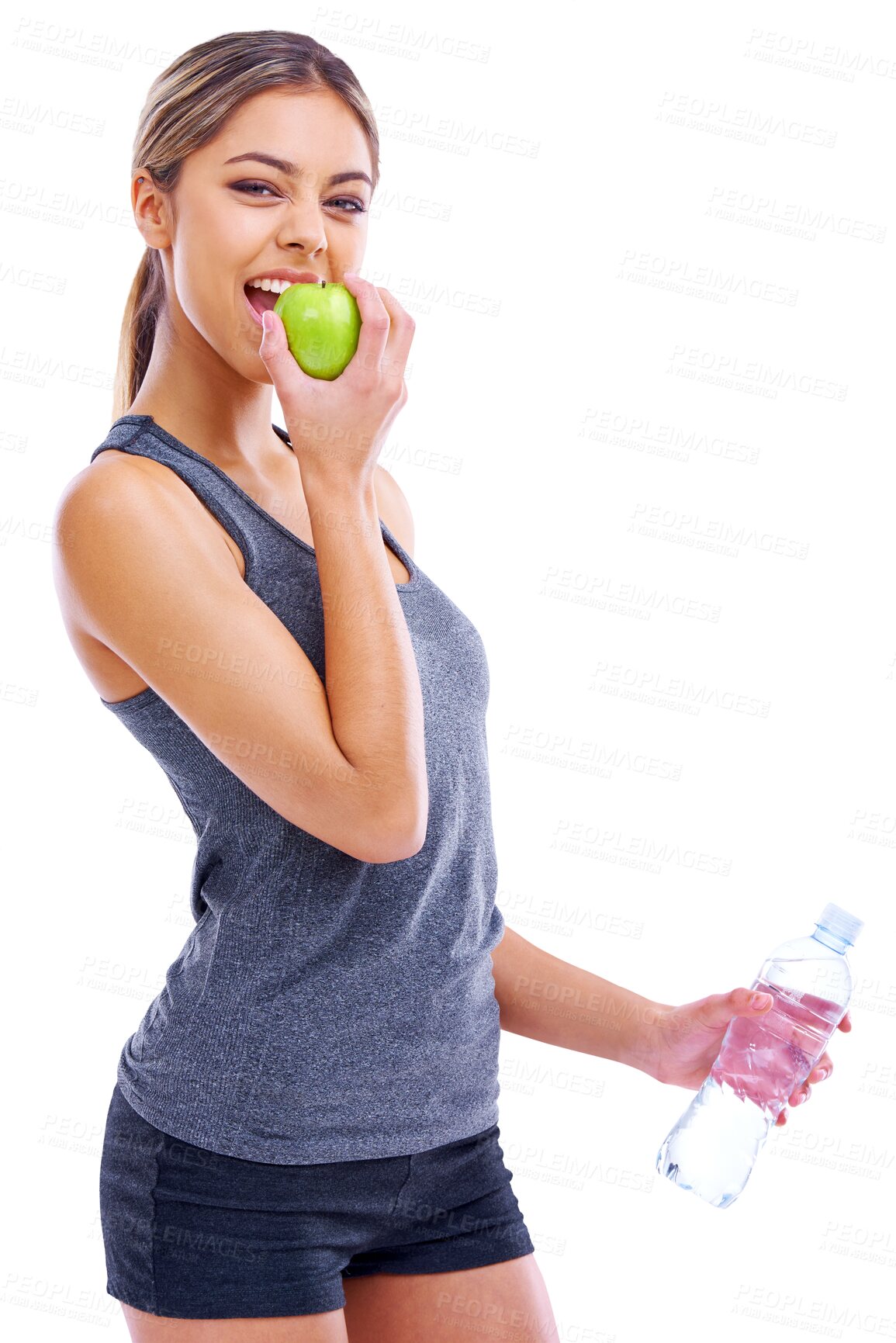 Buy stock photo Woman, fitness and apple for natural nutrition or healthy eating isolated on a transparent PNG background. Portrait of female person, water bottle and biting organic fruit in balance diet or wellness