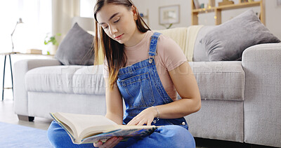 Buy stock photo Relax, learning or girl reading book in house living room with notebook for education or story. Gen z student, 
information or woman on floor with a novel, focus or literature for fun or knowledge