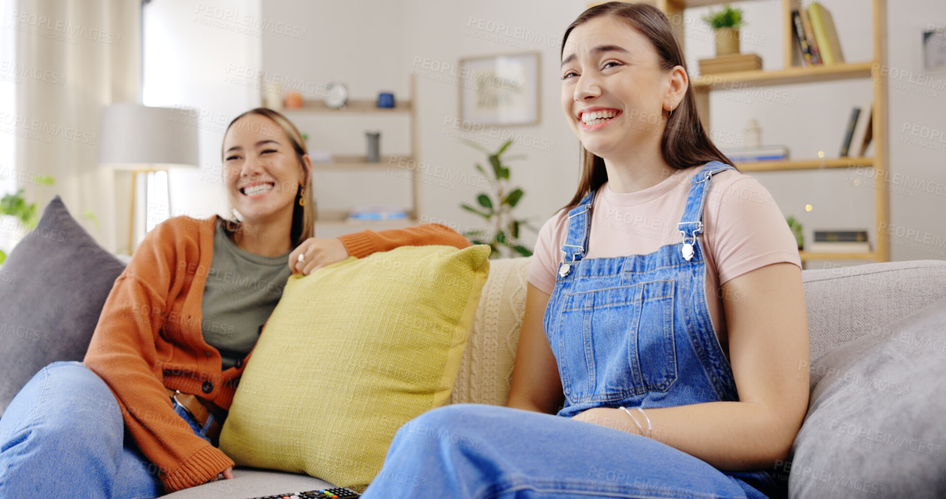 Buy stock photo Happy, television or friends watching tv or streaming movies via subscription to relax on a sofa at home. Lounge, funny comedy or women laughing at an online film series in house living room together