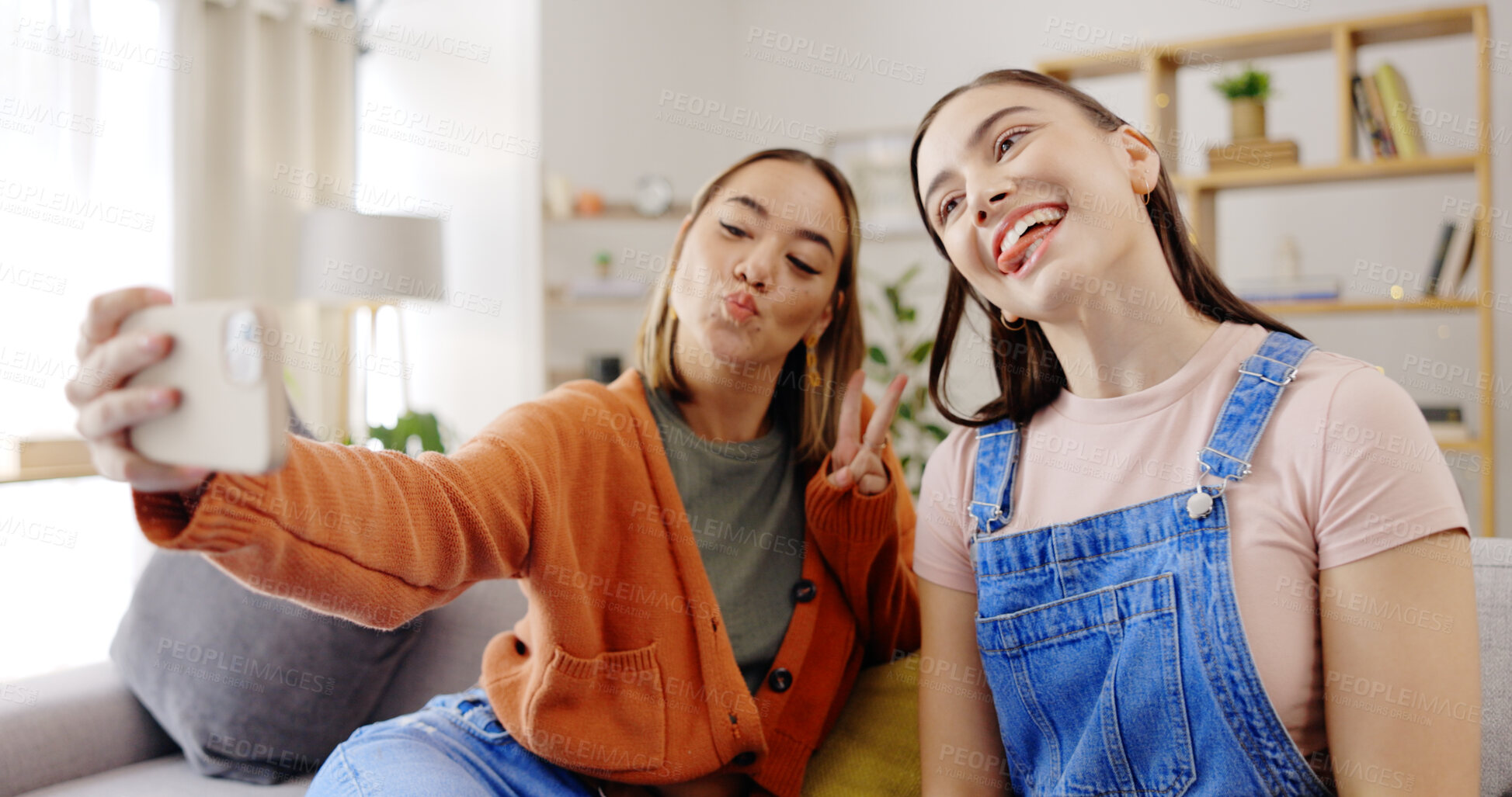 Buy stock photo Happy woman, friends and smile for selfie on sofa, social media or photography together at home. Face of goofy female person with peace sign, emoji or silly memory on living room couch at the house