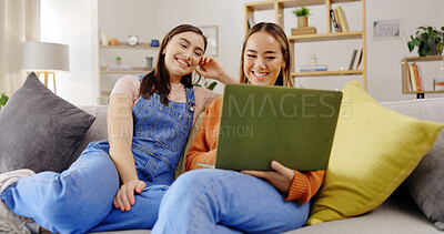 Buy stock photo Relax, friends or women with a laptop on sofa in living room streaming movies, film or videos online. Happy people, technology or girls watching program on subscription or membership on home couch