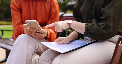 Buy stock photo Business, closeup and women on bench, phone or planning a collaboration, documents or discussion. Professionals, freelancers or partners in a park with a mobile app for a project, paperwork or report