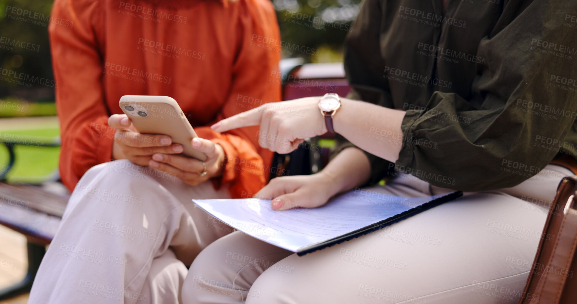 Buy stock photo Business, closeup and women on bench, phone or planning a collaboration, documents or discussion. Professionals, freelancers or partners in a park with a mobile app for a project, paperwork or report