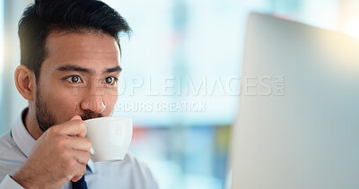 Buy stock photo Focused lawyer sipping a cappuccino while working on a case for his upcoming legal trial. Closeup of the face and head of a young male advocate researching the law on his computer while preparing