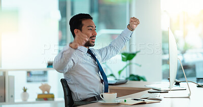 Buy stock photo Excited business man cheering at his desk. Successful male banker or happy financial advisor celebrating his trading victory in a modern office. Young guy reading good news on his computer at work.