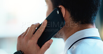 Buy stock photo Business man talking on a phone call in an office. Closeup of corporate professional and entrepreneur from the back networking to build a successful empire. Communicating plans and deals with clients