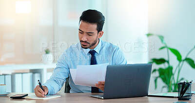 Buy stock photo Lawyer and attorney working on corporate plans and compiling legal reports for a case at his desk. Business man and project manager reading and writing notes while working on a laptop in an office