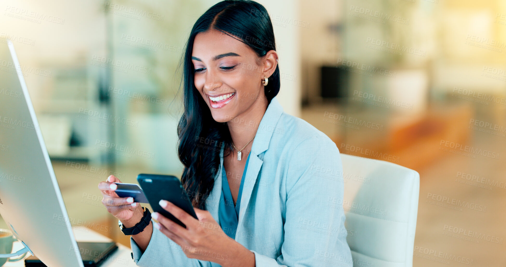 Buy stock photo Happy woman making online payment with phone and bank card for typing credit details into online banking app. Young business woman enjoying virtual shopping or wireless purchase while sitting inside