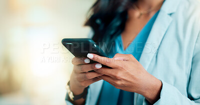 Buy stock photo Closeup of a woman texting, browsing and scrolling on a phone in an office. Hands of a corporate executive, busy entrepreneur and business expert typing a message while networking with clients online
