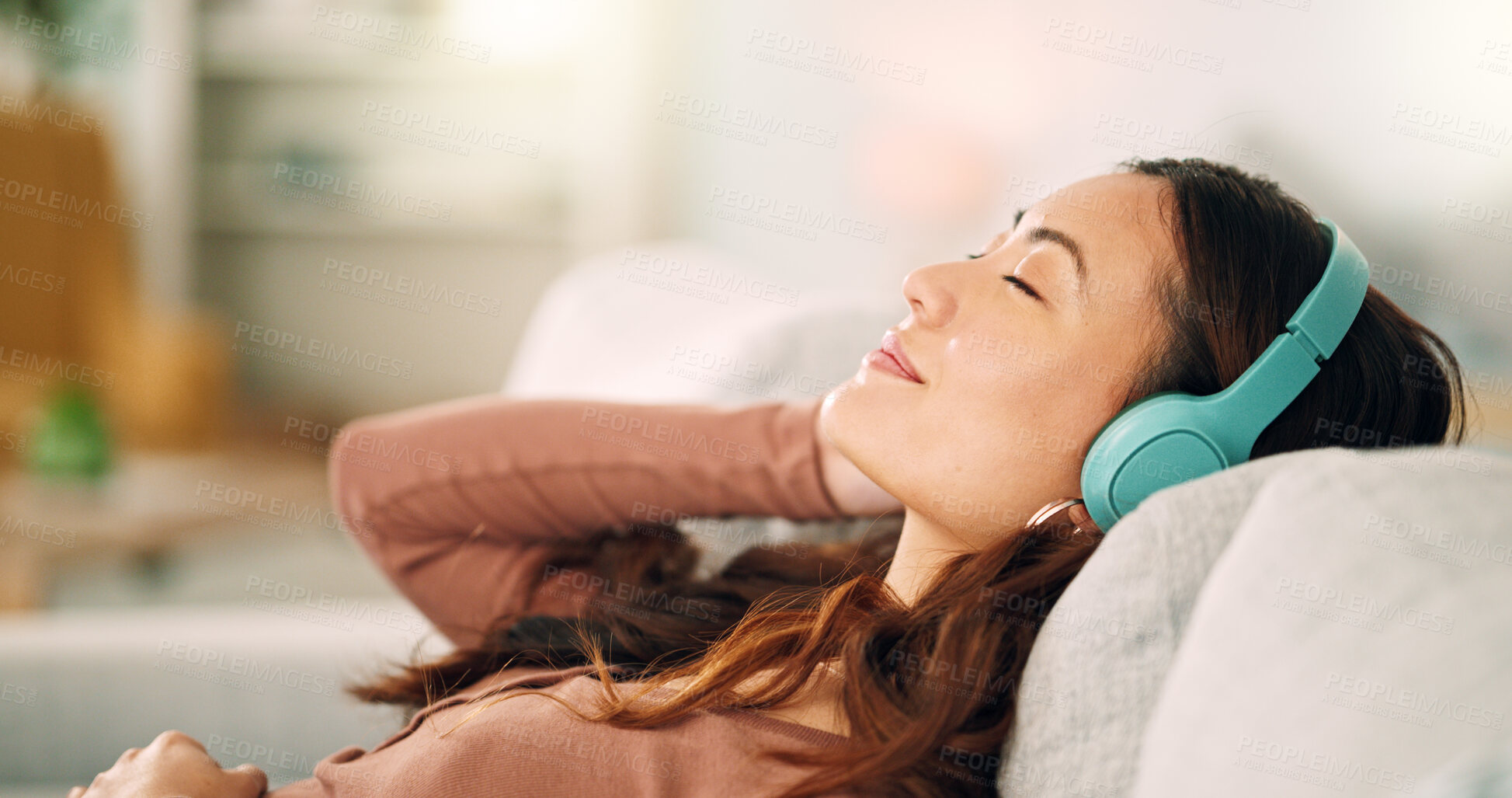 Buy stock photo Woman headphones, listening to relax music, podcast and smile with a calm, zen and peaceful day at home. Happy Asian female and relaxed woman sitting on a living room sofa and meditation with audio