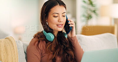 Buy stock photo Phone, laptop and call with a woman talking on a mobile while working on the internet with her computer at home. Email, technology and conversation with a young female in the living room of her house