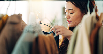 Buy stock photo Fashion, shopping and customer with a woman in a store for retail while looking at clothes to buy or purchase. Buying, consumerism and choice with a female purchaser in a clothing boutique or shop