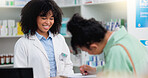 Pharmacist helping a customer in a pharmacy. Woman signing medical paperwork to collect over the counter and prescription medication from a friendly healthcare worker in a chemist or dispensary