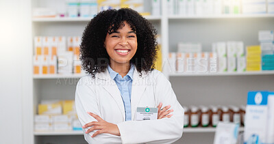 Buy stock photo Portrait of a pharmacist with folded arms against a background of prescription medication. Happy young professional health care worker waiting to diagnose and prescribe pills at a clinic dispensary
