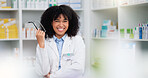 A friendly female pharmacist with a bright smile is about to help patients at the dispensary. Portrait of happy woman healthcare professional smiling at the pharmacy. A doctor taking off her glasses
