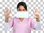 PNG cropped portrait of an attractive young female healthcare worker holding up a mask in studio against a grey background