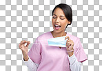 PNG cropped shot of an attractive young female healthcare worker holding up a mask in studio against a grey background