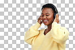 PNG shot of a young woman wearing headphones while posing against a grey background