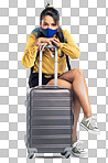 PNG shot of a young woman wearing a mask while sitting on her suitcase