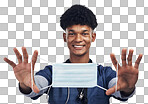 PNG of a male nurse holding up a surgical mask while standing against a grey background