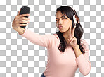 PNG of a beautiful young woman wearing headphones and taking a selfie against a grey background