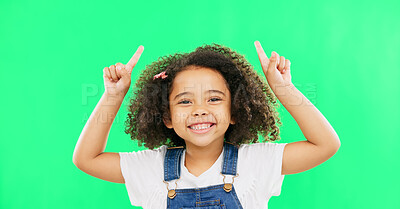 Buy stock photo Girl, hand pointing up and green screen portrait with advertising for product placement and creative with smile. Mexican child, face and happiness with youth for mockup   and studio background 

