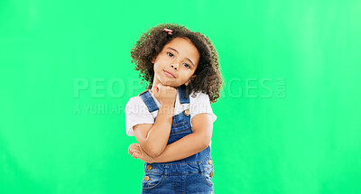 Cute, face and child in a studio with green screen with a adorable, sweet and happy expression. Happiness, smile and portrait of a young girl kid posing while isolated by a chroma key background.