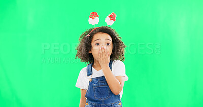 Buy stock photo Little girl, shock and portrait of child on green screen with hand on mouth in surprise against a studio background. Face of female person or kid with Christmas antlers for festive secret, wow or omg