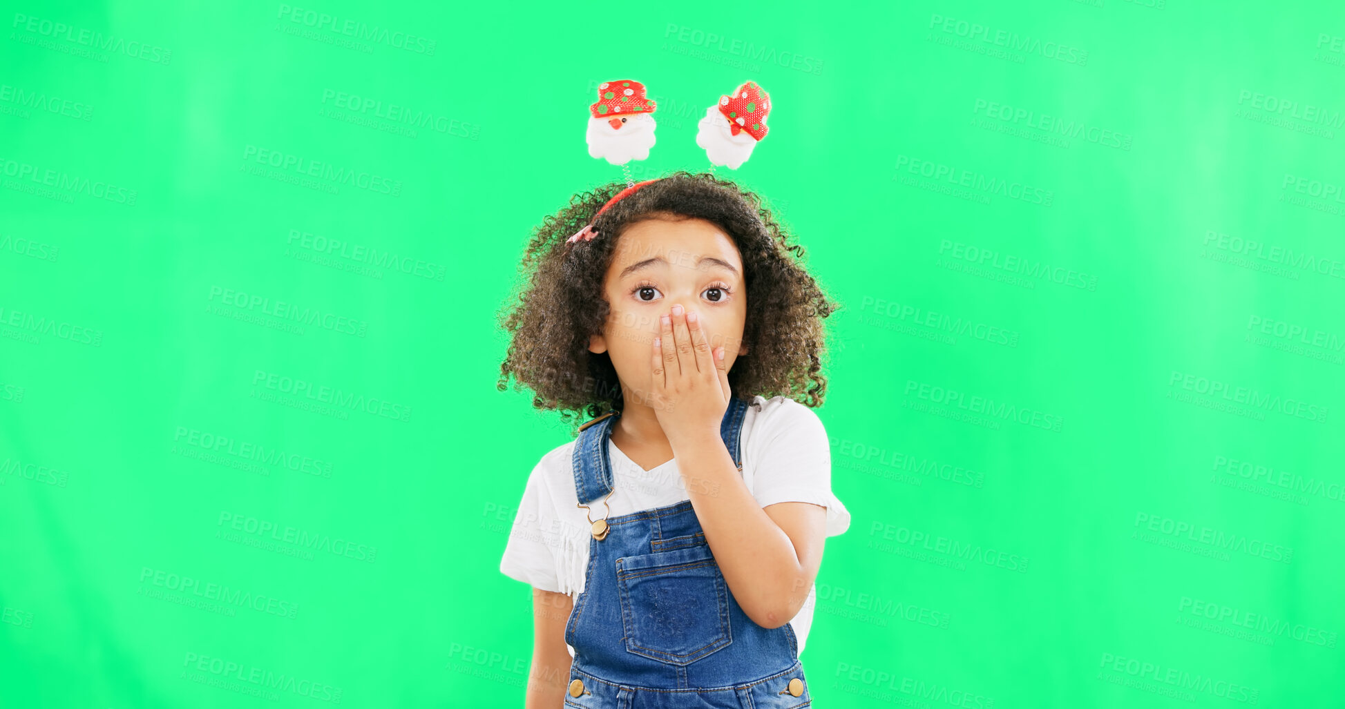 Buy stock photo Little girl, shock and portrait of child on green screen with hand on mouth in surprise against a studio background. Face of female person or kid with Christmas antlers for festive secret, wow or omg
