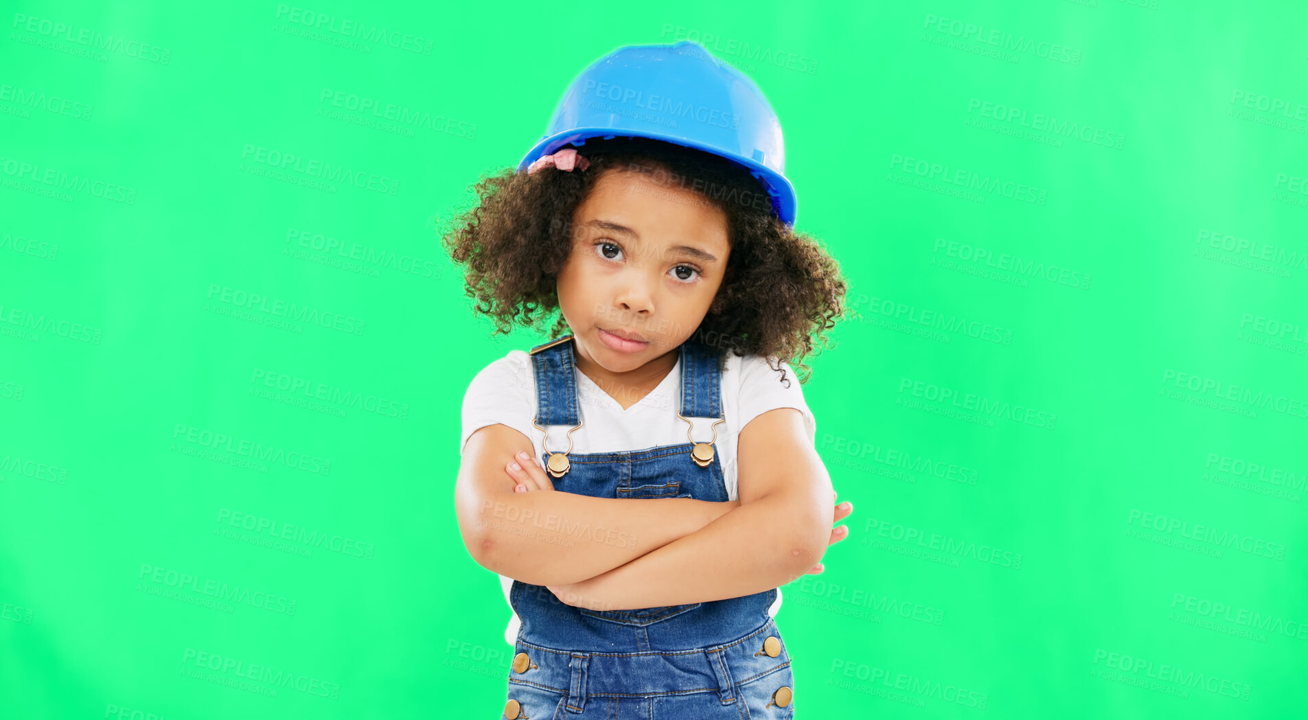 Buy stock photo No, green screen and portrait of child shaking head arms crossed feeling sad isolated in studio background. Helmet, safety and annoyed young kid is frustrated, upset and refuse gesture