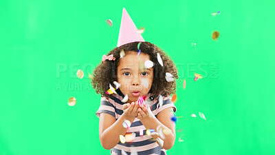 Little girl, birthday and blowing confetti on green screen for party celebration isolated against a studio background. Portrait of cute kid celebrating event with glitter decor for new year on mockup