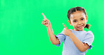 Happy, pointing and mockup with girl in studio for product placement, promotion and offer. Choice, launch and smile with portrait of child on green background for brand, advertisement and display