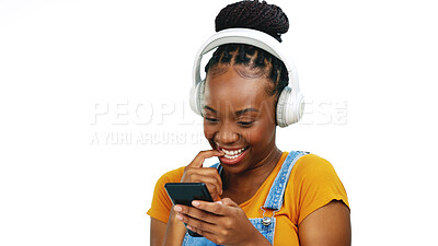 Black woman, music headphones and phone in studio online for communication, chat and shy flirting. African person smartphone and listening to sound typing on social media isolated on white background