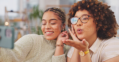 Happy women smiling for photo, memory or facial expression for social media post. Woman, friends and smile for selfie, vlog or profile picture together blowing kiss by living room table at home.