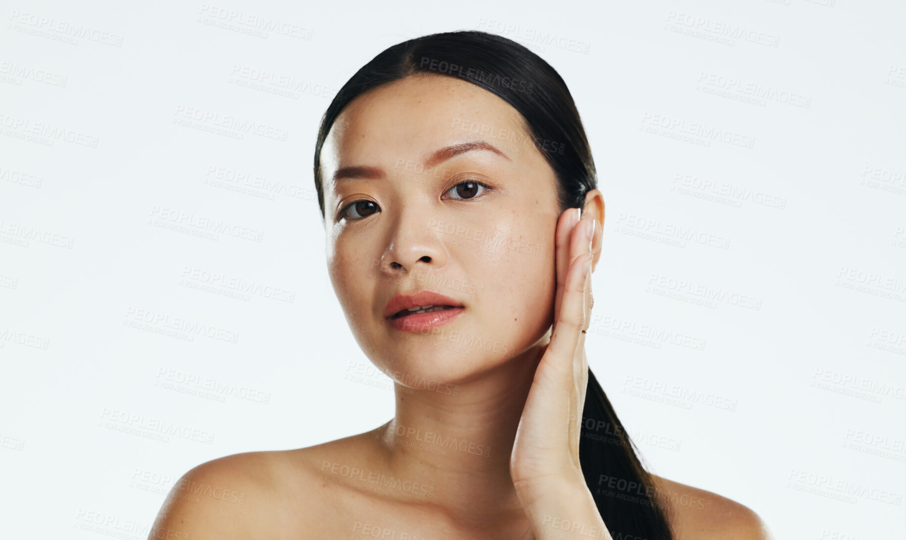 Buy stock photo Skincare, asian woman and touch face in studio for beauty, dermatology or cosmetics on white background. Female model, portrait and facial aesthetic glow of shine, laser transformation and wellness