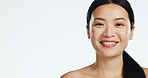 Face, asian woman and laughing for beauty in studio, isolated white background and mockup space. Portrait, happy female model and advertising mock up of dermatology, skincare or cosmetics coming soon