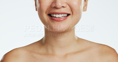 Smile, dental and mouth of a woman in a studio laughing with clean, white and healthy teeth. Dentistry, wellness and closeup of female model with oral hygiene treatment or routine by white background