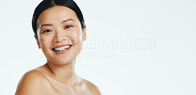Skincare, asian woman and face of beauty, smile or happiness of laser results on white background. Happy model, studio portrait and aesthetic wellness of salon cosmetics, healthy shine or dermatology