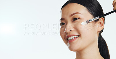 Asian woman, face and brush cream for beauty, aesthetic skincare and mockup white background. Happy studio model, makeup and facial lotion for dermatology, collagen cosmetics and smile of happiness