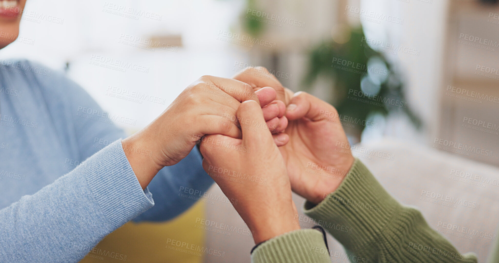 Buy stock photo Couple holding hands for support, love and care of empathy, kindness and praying for respect, hope or relax. Gratitude, trust and closeup of counseling for loyalty, commitment or solidarity at home